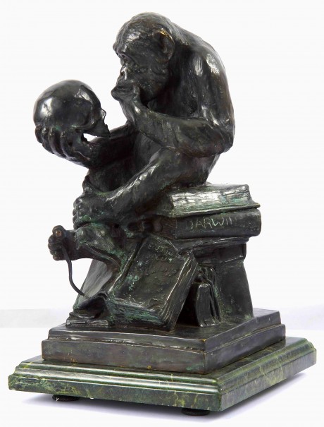 Sculpture of Chimpanzee examining a human skull